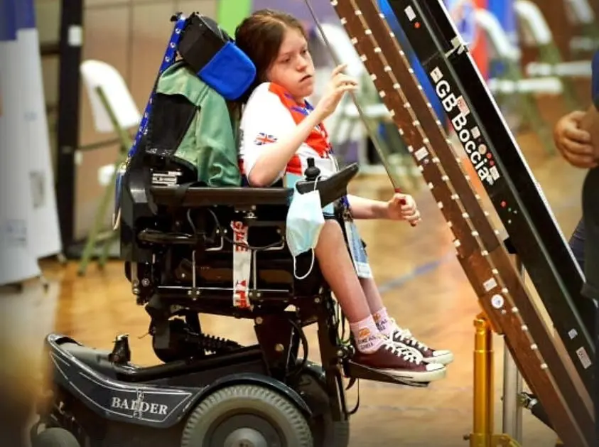 Paralympian, Sally Kidson, sitting in her Balder F380 playing boccia