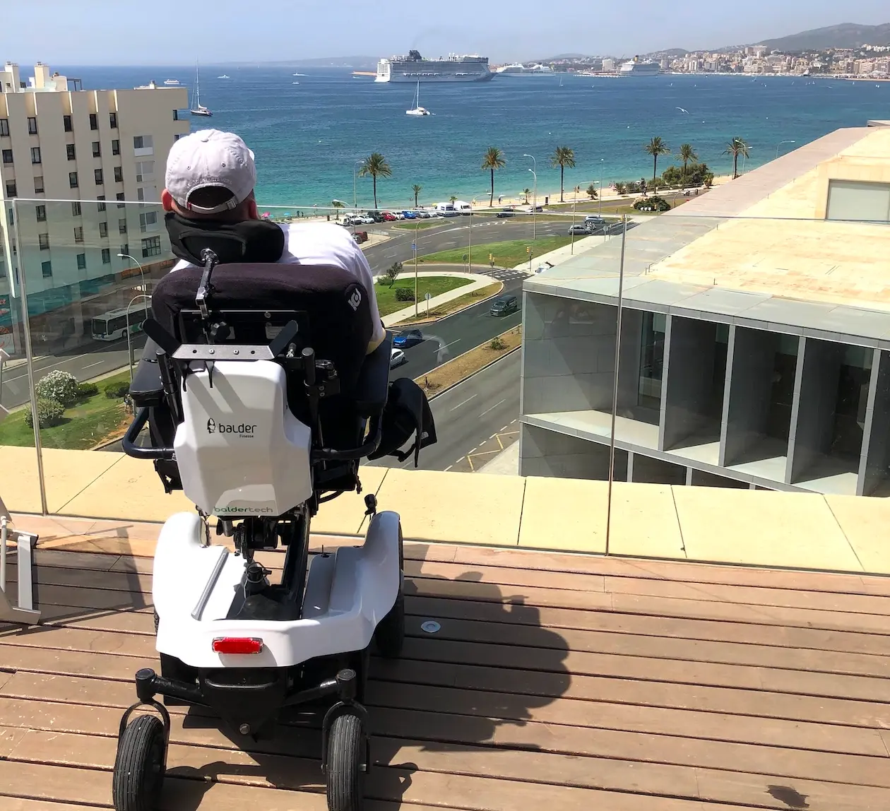Lewis, sitting on a balcony in his Balder F380, overlooking the sea