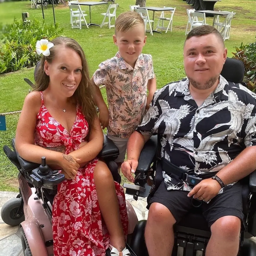 Faye and Stevie sitting in their respective Balder F380's. Their son is standing between them